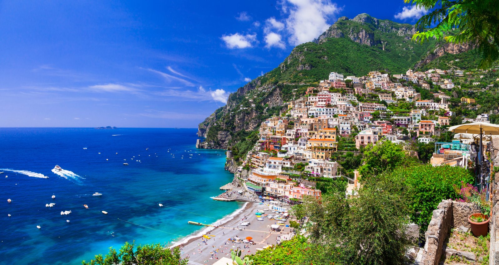 Iconic colorful houses of Positano overlooking the Mediterranean sea on the Amalfi Coast.
